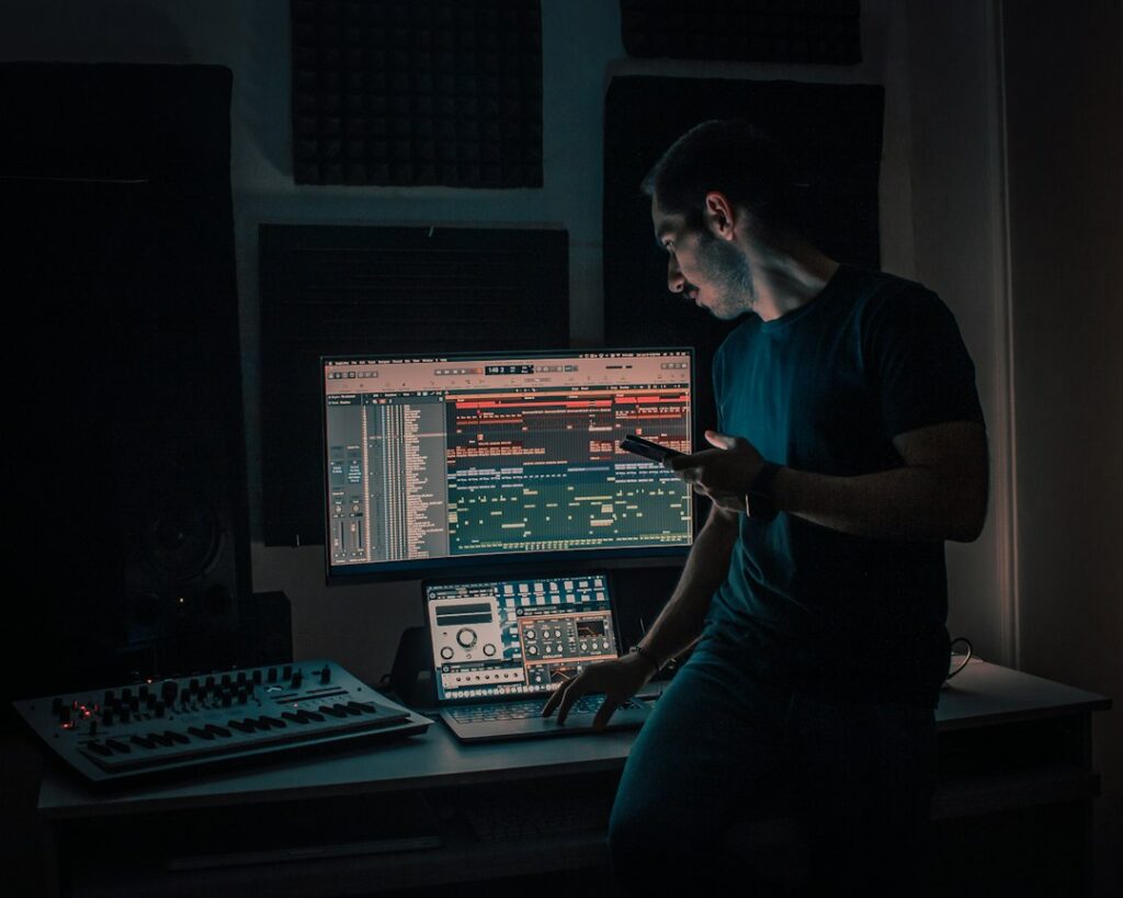 Music producer in studio — illustrative photo by Rezli